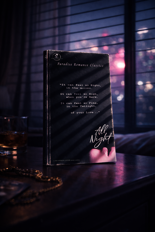 Book titled 'All Night' on a table with a blurred cityscape background